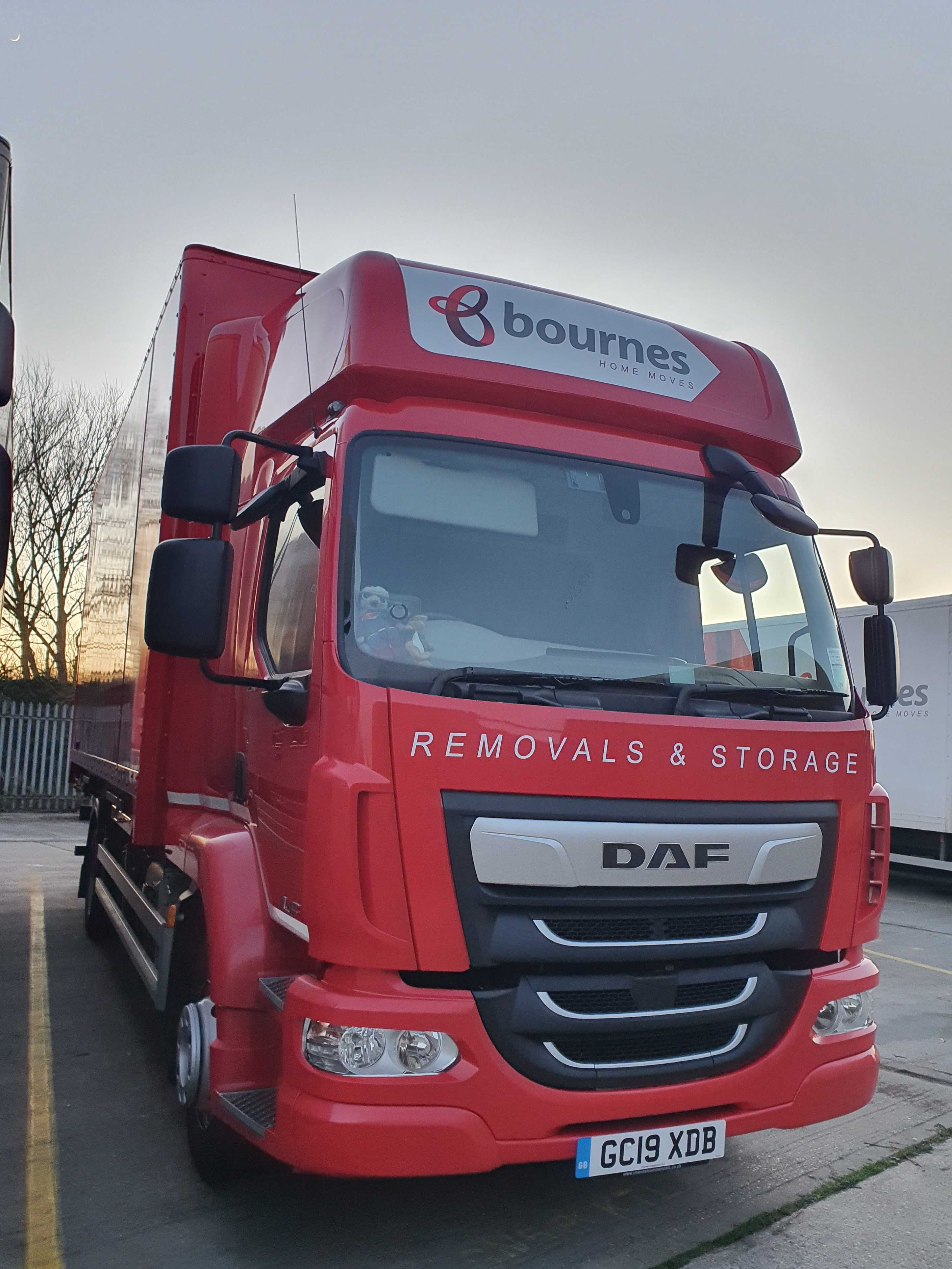 Bournes new red removals lorry from the front